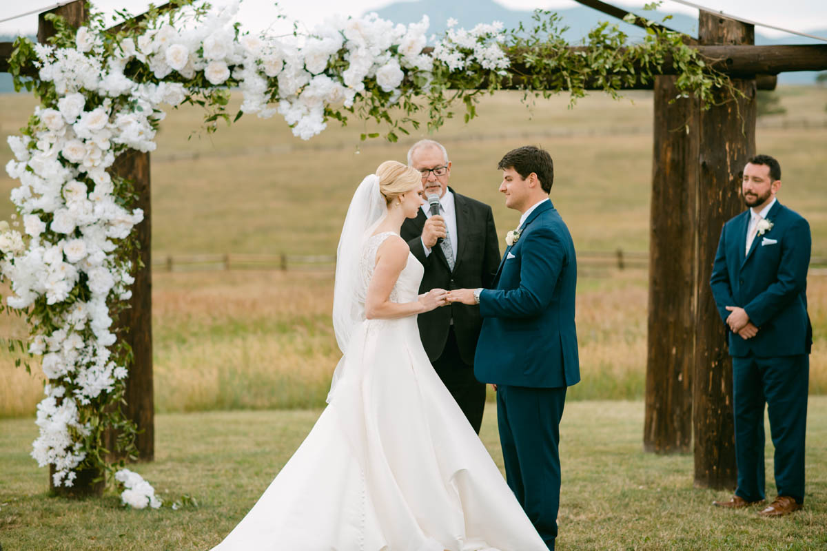 Wedding couple exchanging vows at Spruce Mountain Ranch.