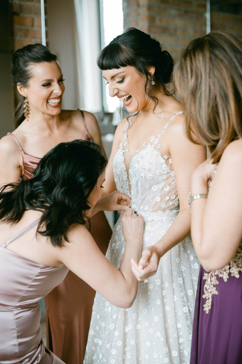 Bride getting ready with her bridesmaids.