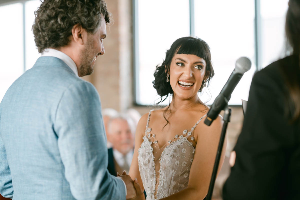 Walden bride laughing during wedding ceremony.