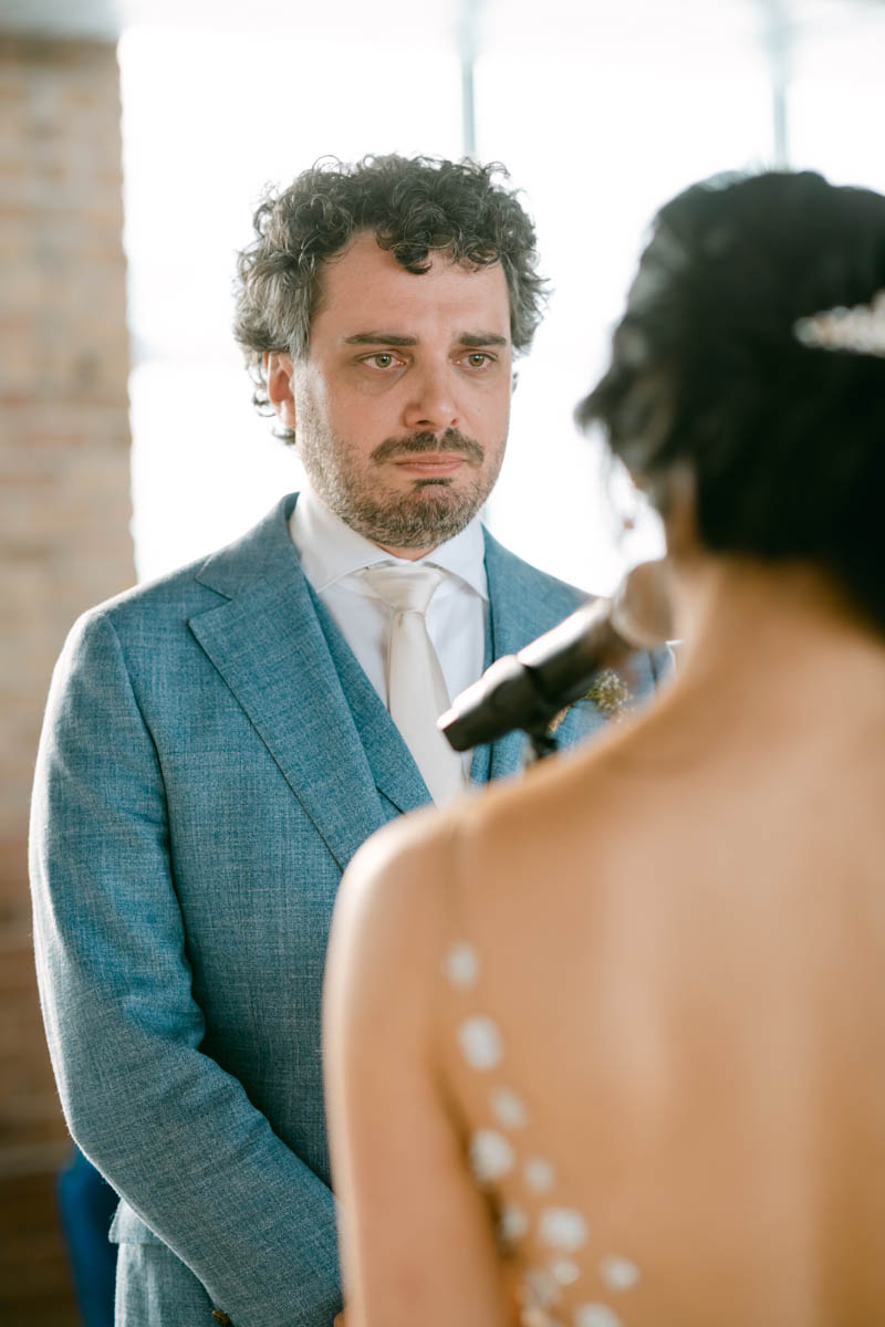 Tearful groom at wedding ceremony.