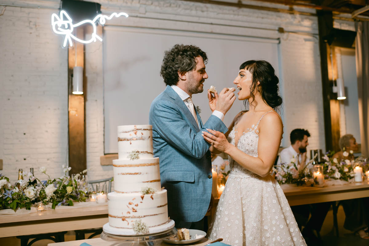 Bride and groom cutting the cake.