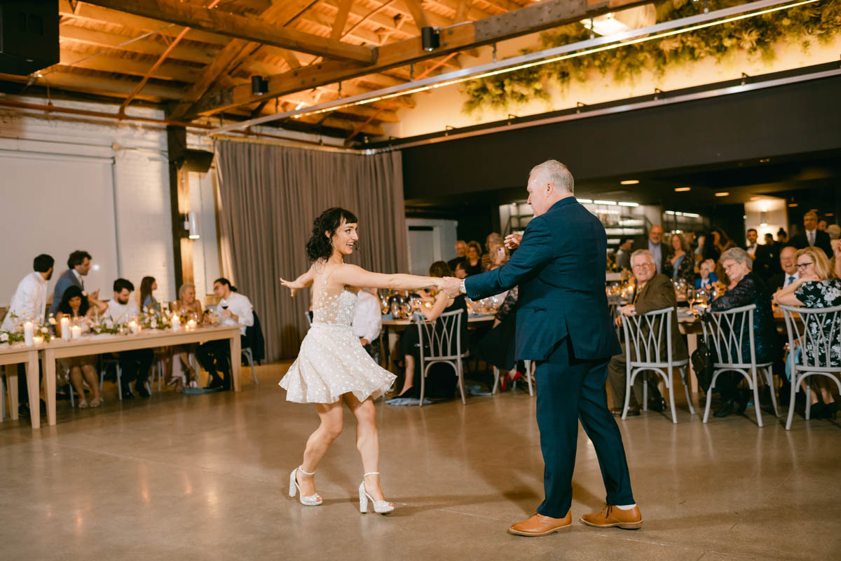 Bride dancing with his daughter.
