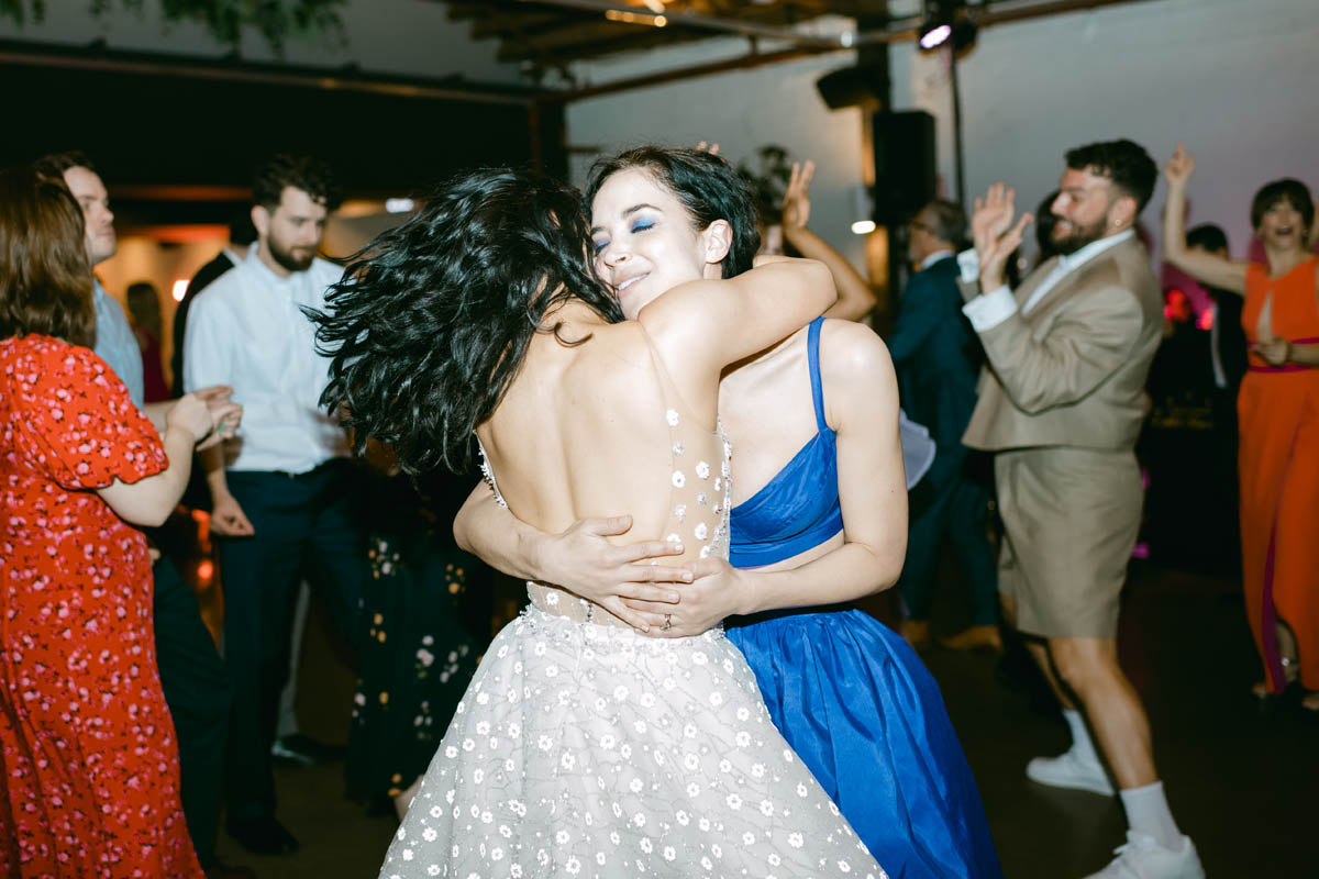 Bride dancing with wedding guest.