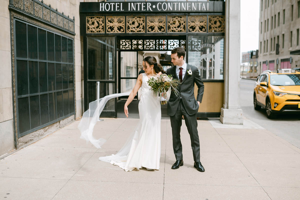 Bride and groom pose for photos at the Intercontinental Hotel wedding.