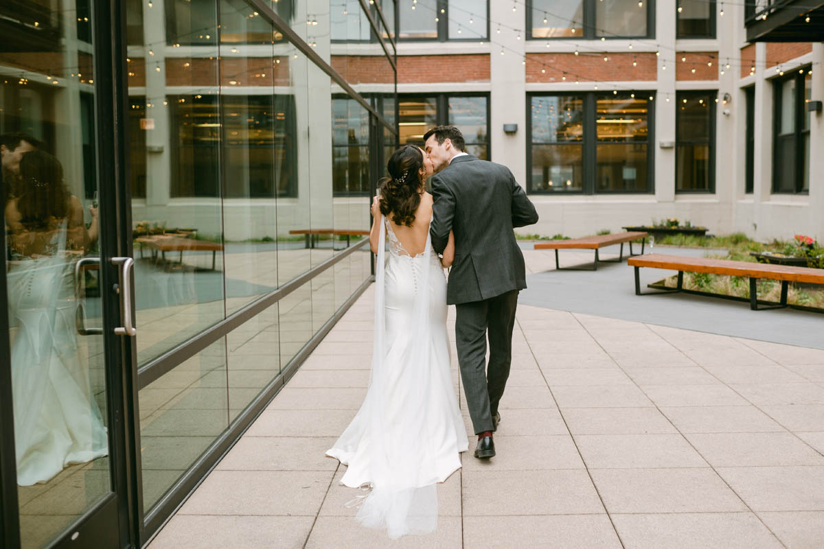 Couple kissing after wedding ceremony.