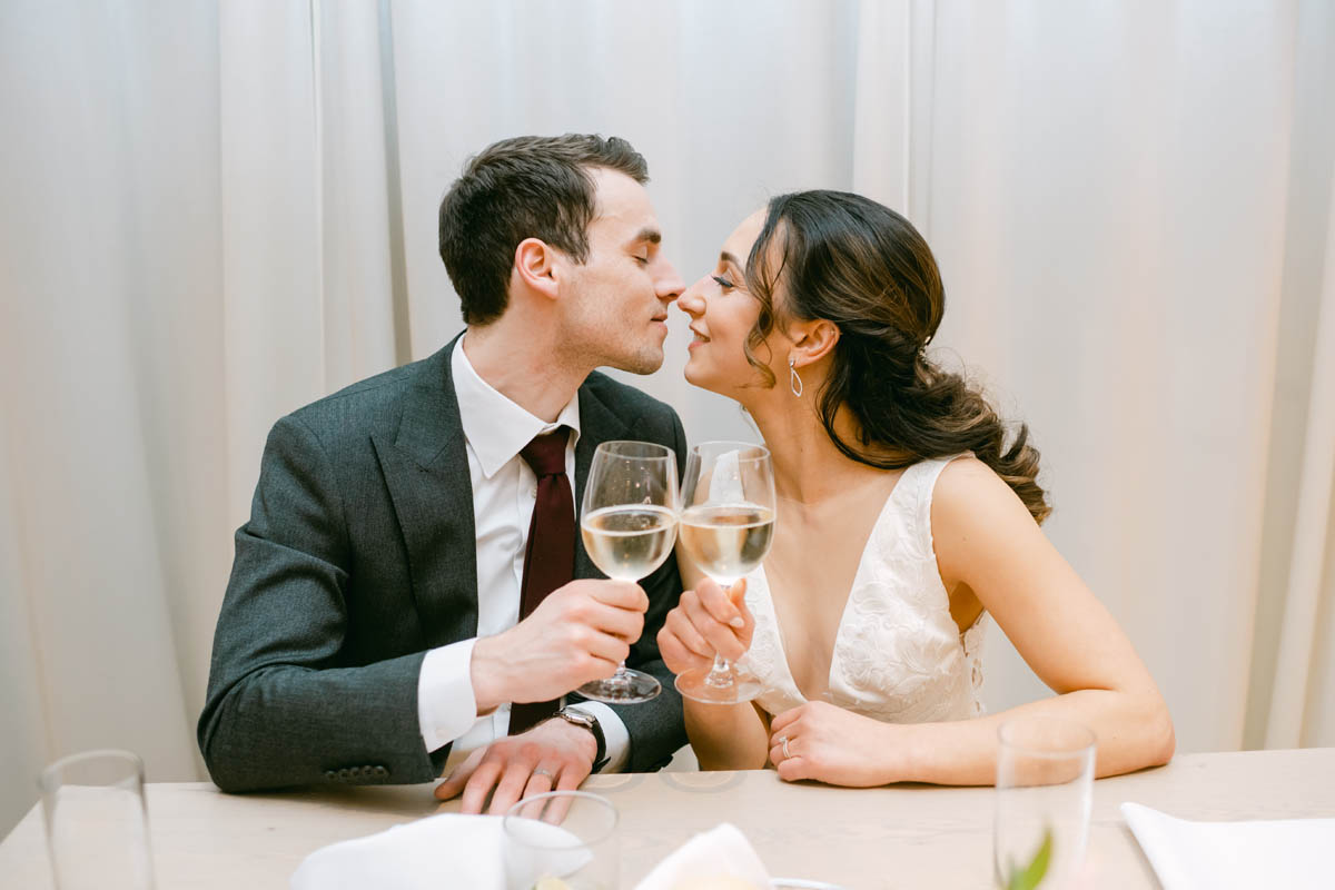 Couple toasting at wedding reception.