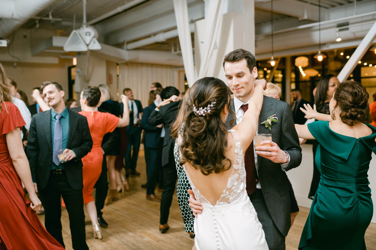 Bride and groom dancing at wedding reception.