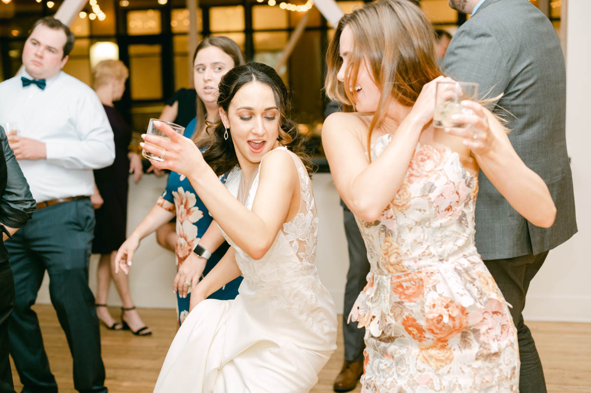 Bride dancing at wedding reception.