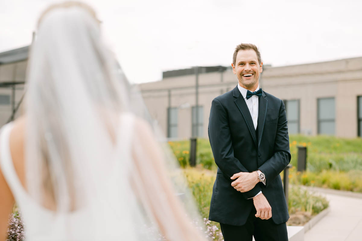 Groom seeing bride for first look.
