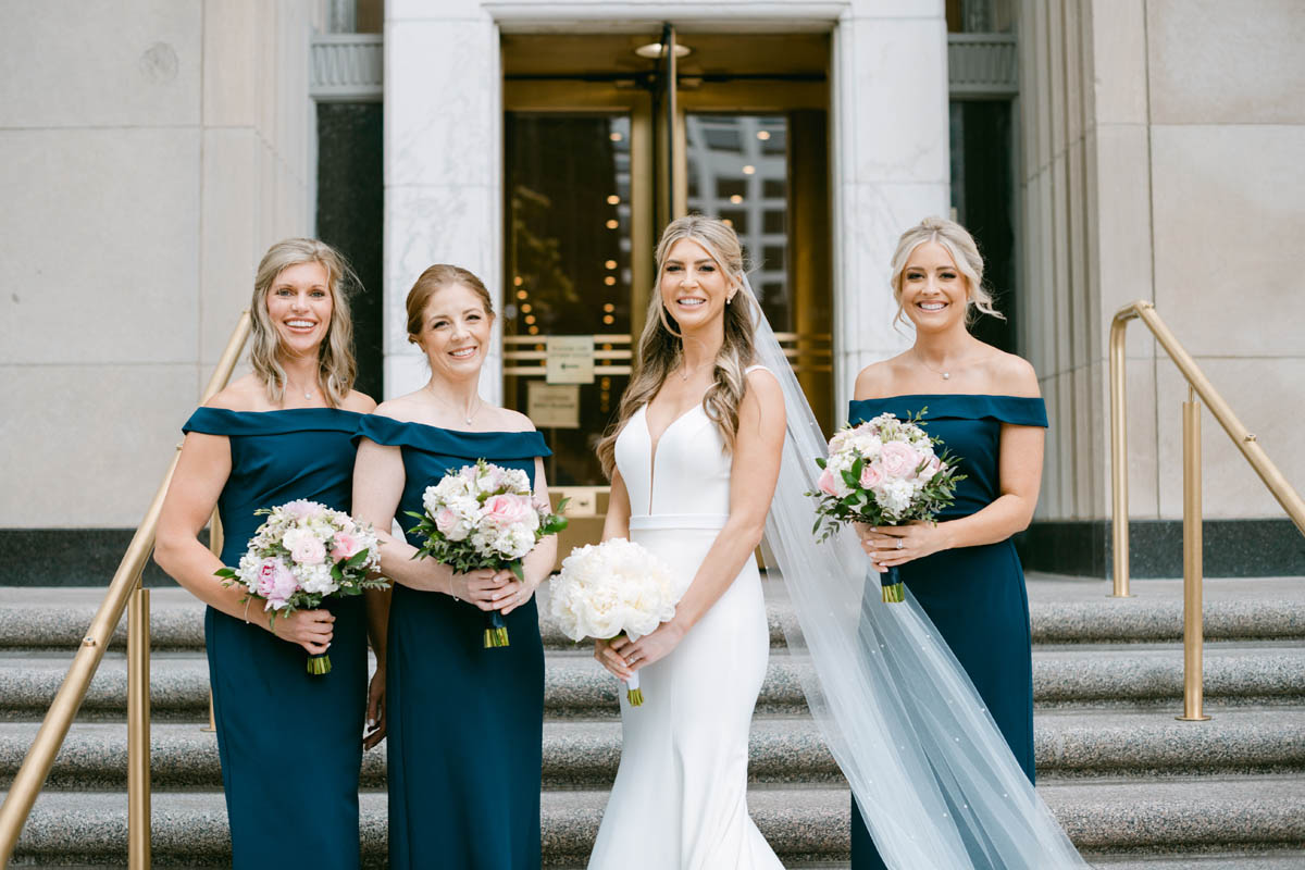 Bridesmaids in blue dresses at Old Post Office wedding