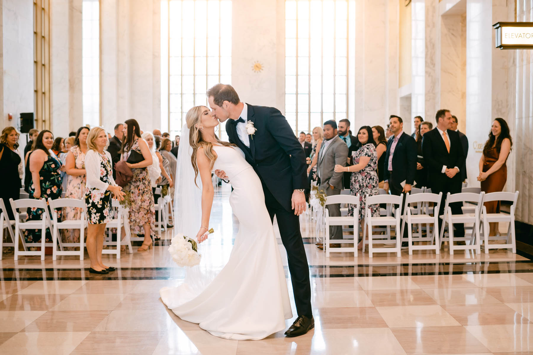 Bride and groom kiss at Old Post Office wedding.