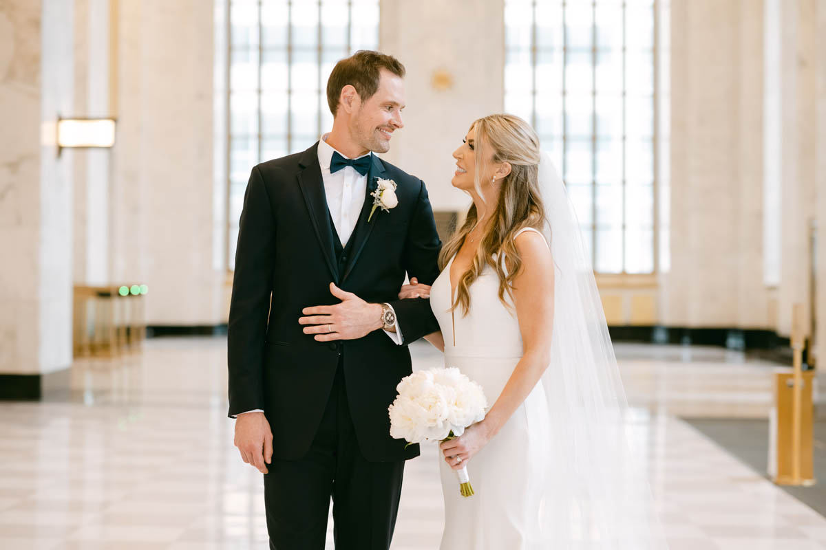 Couple posing at Old Post Office wedding.