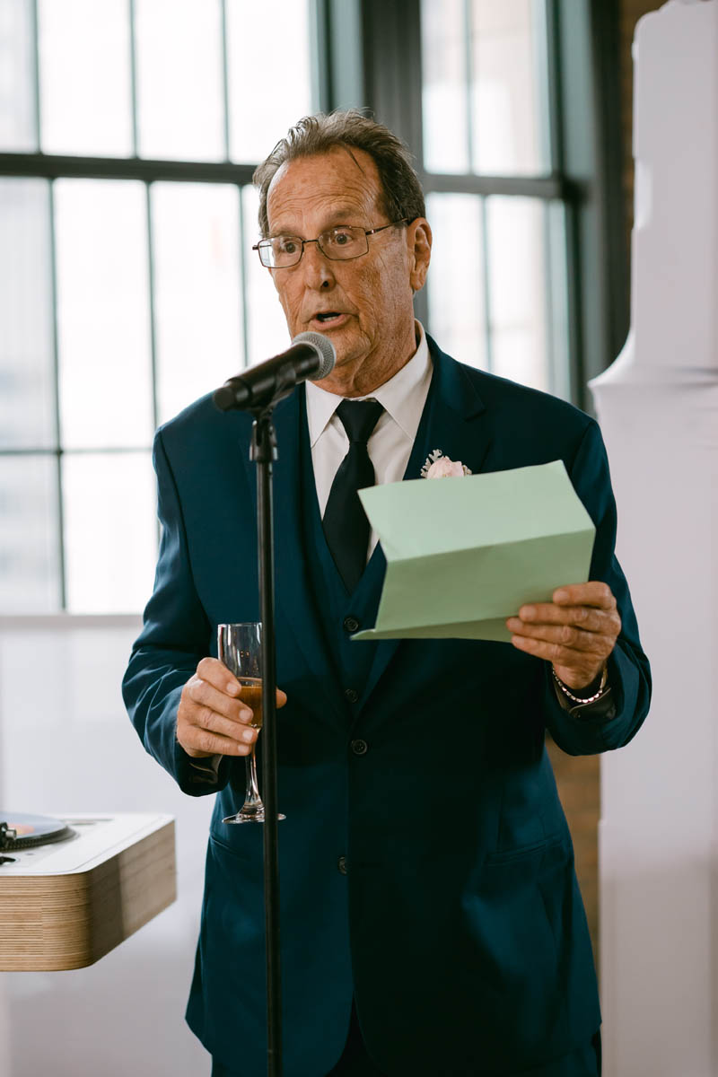 Father toasting his daughter.