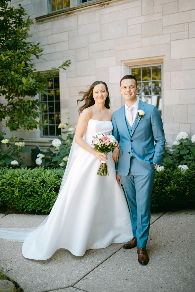 Bride and groom posing at Michigan Shores Club wedding