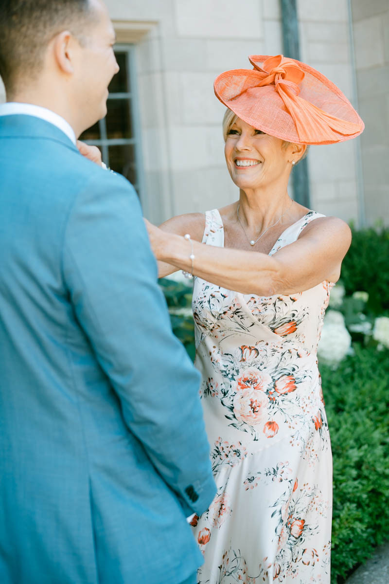 Groom's mom adjusting tie