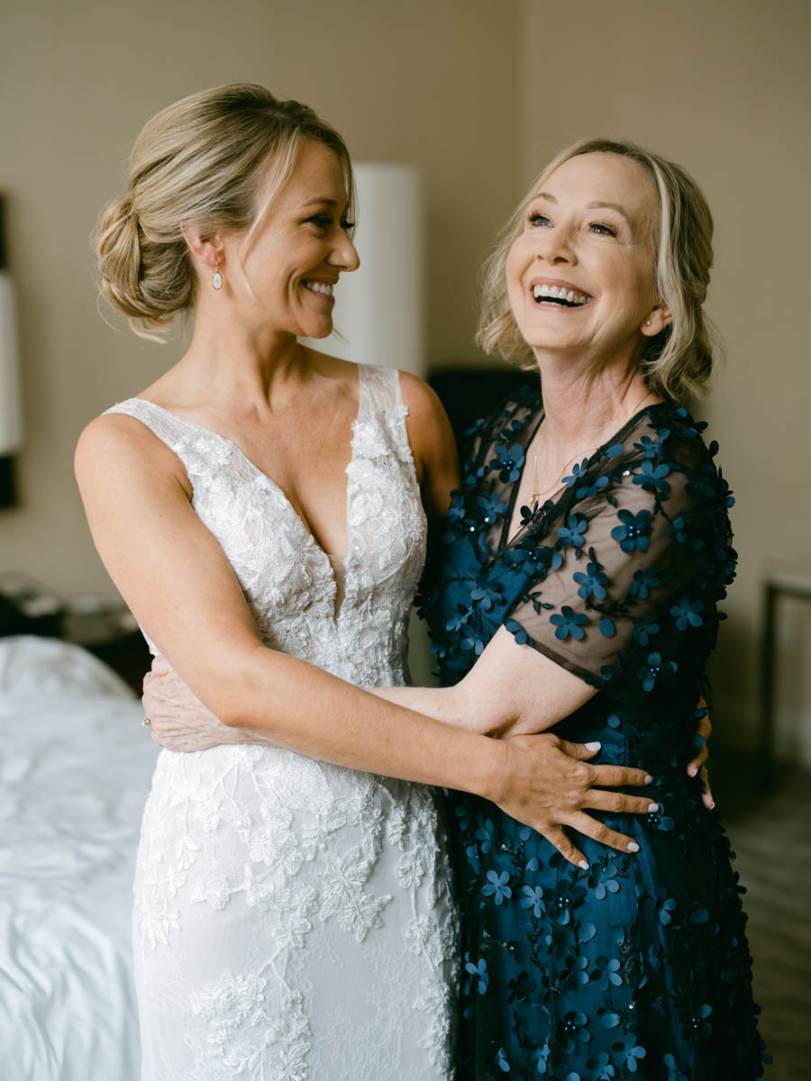 Bride laughing with her mom