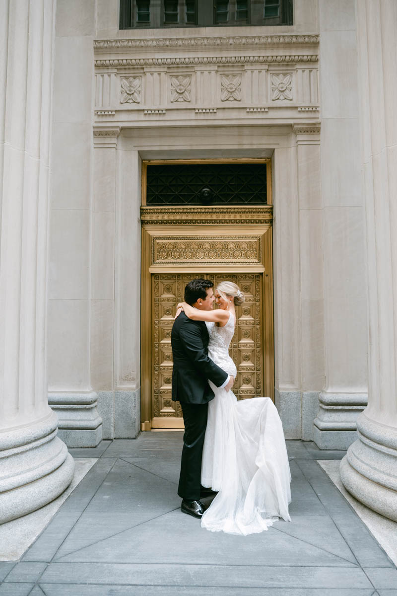 Bride and groom posing at Chicago Board of Trade wedding