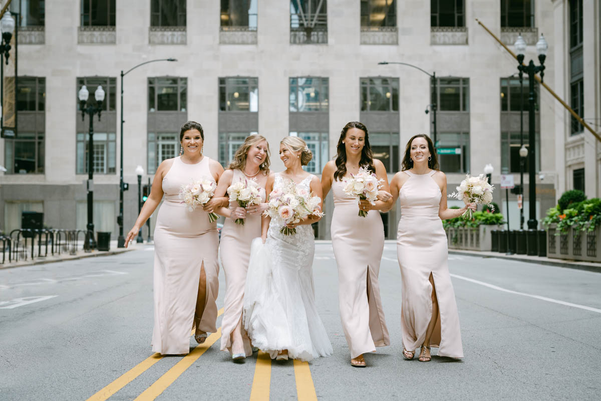 Bridesmaids in pink bridesmaid dresses at Chicago Board of Trade