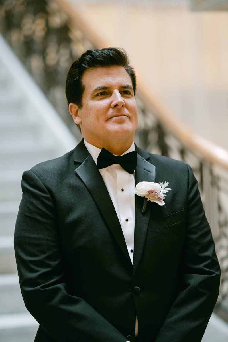 Groom seeing bride walking down the aisle