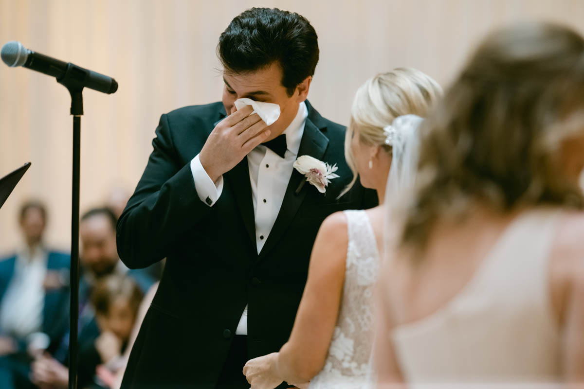 Groom wiping away tears at Rookery Building wedding