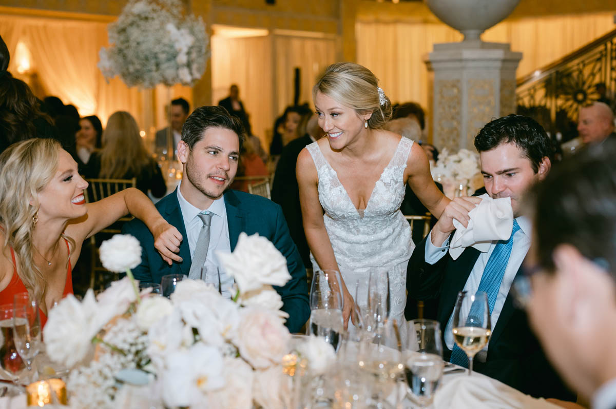Bride talking to wedding guests