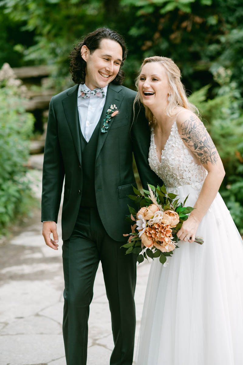 Bride and groom posing for Lilly Pond wedding photos