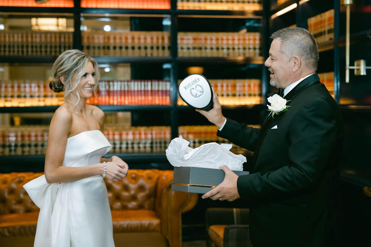 bride giving her father a gift