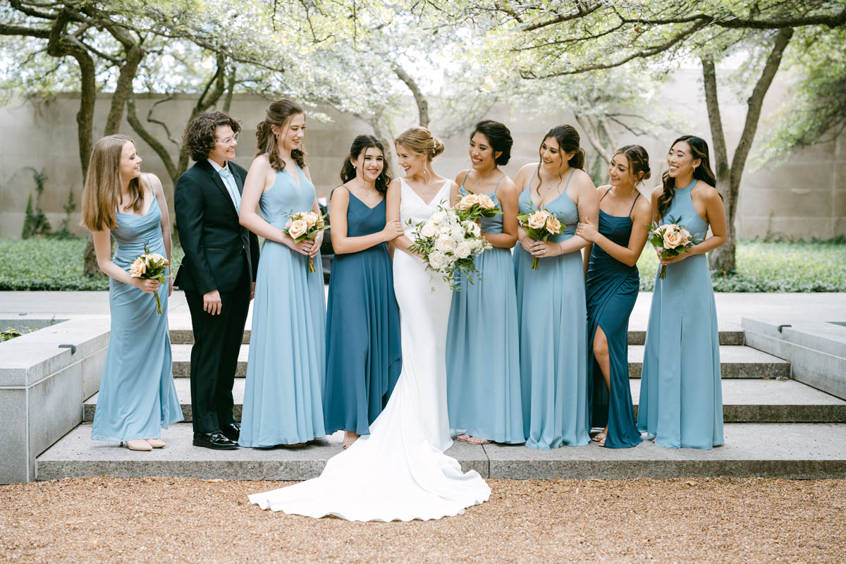 bridesmaids in blue dresses at art institute garden