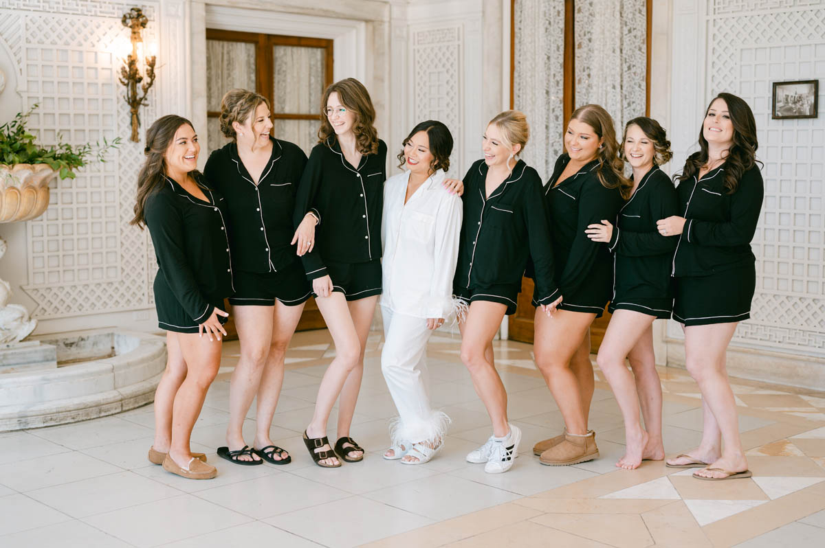 bride with bridesmaids in black robes