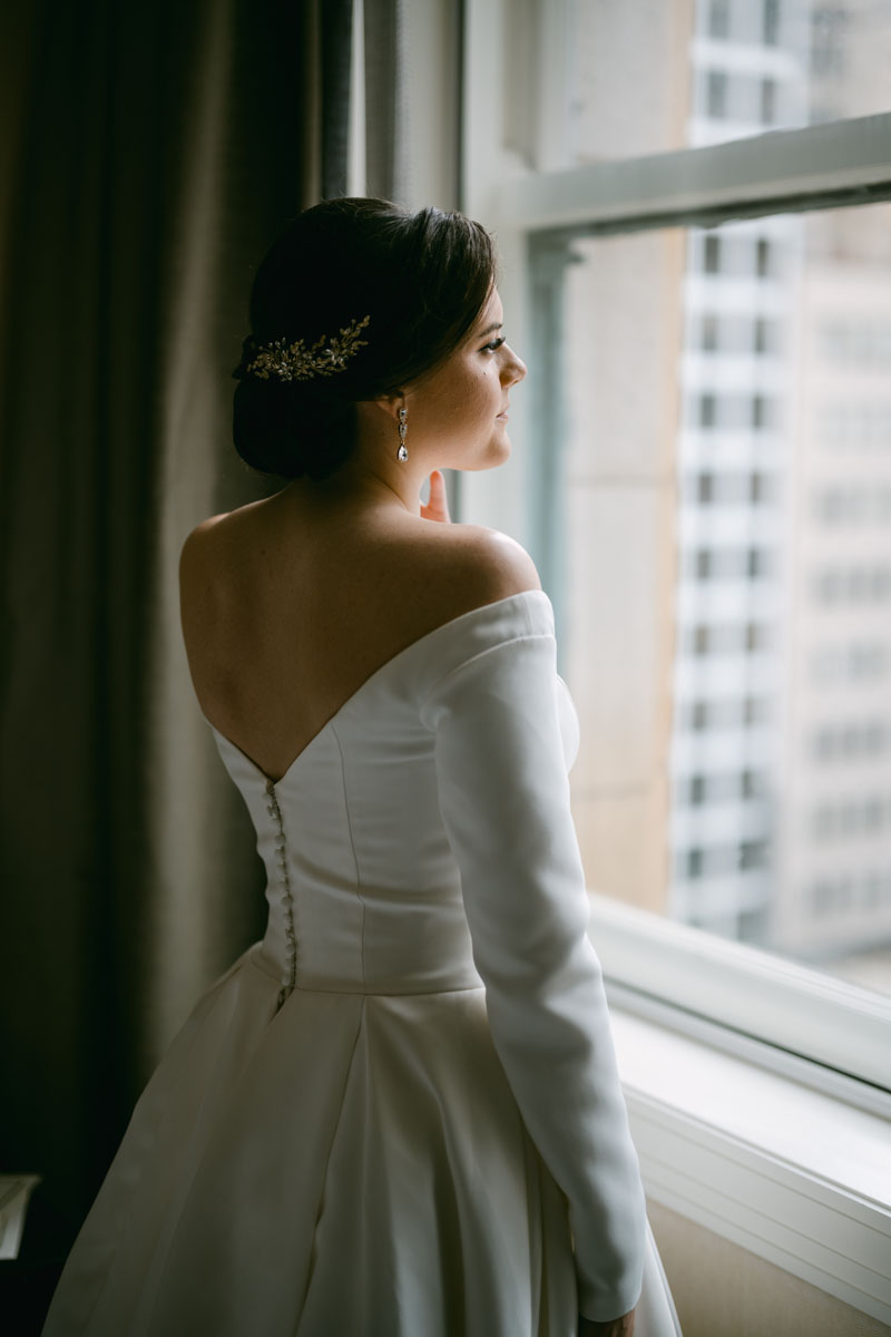 Bride looking out the window at JW Marriott wedding
