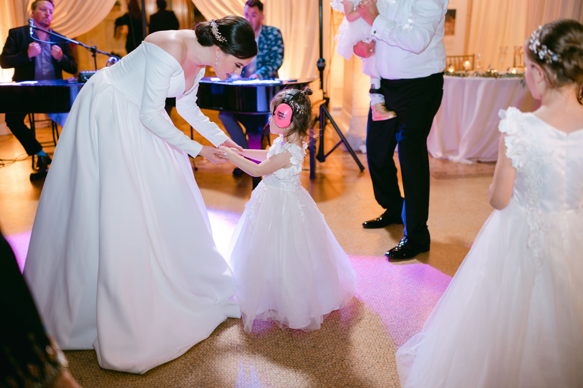 bride dancing with flower girl
