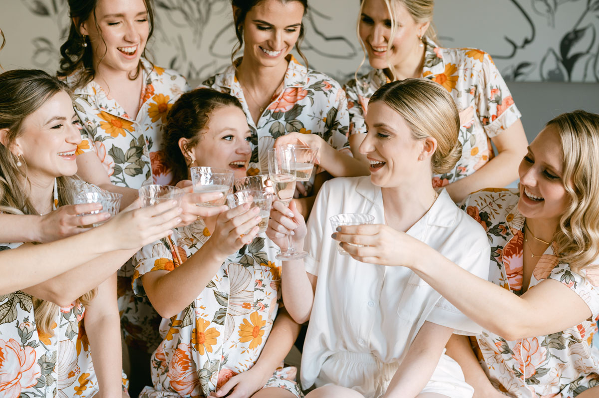 bridesmaids in pajamas champagne pop