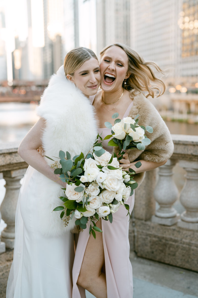 bridesmaids laughing at chicago riverwalk wedding