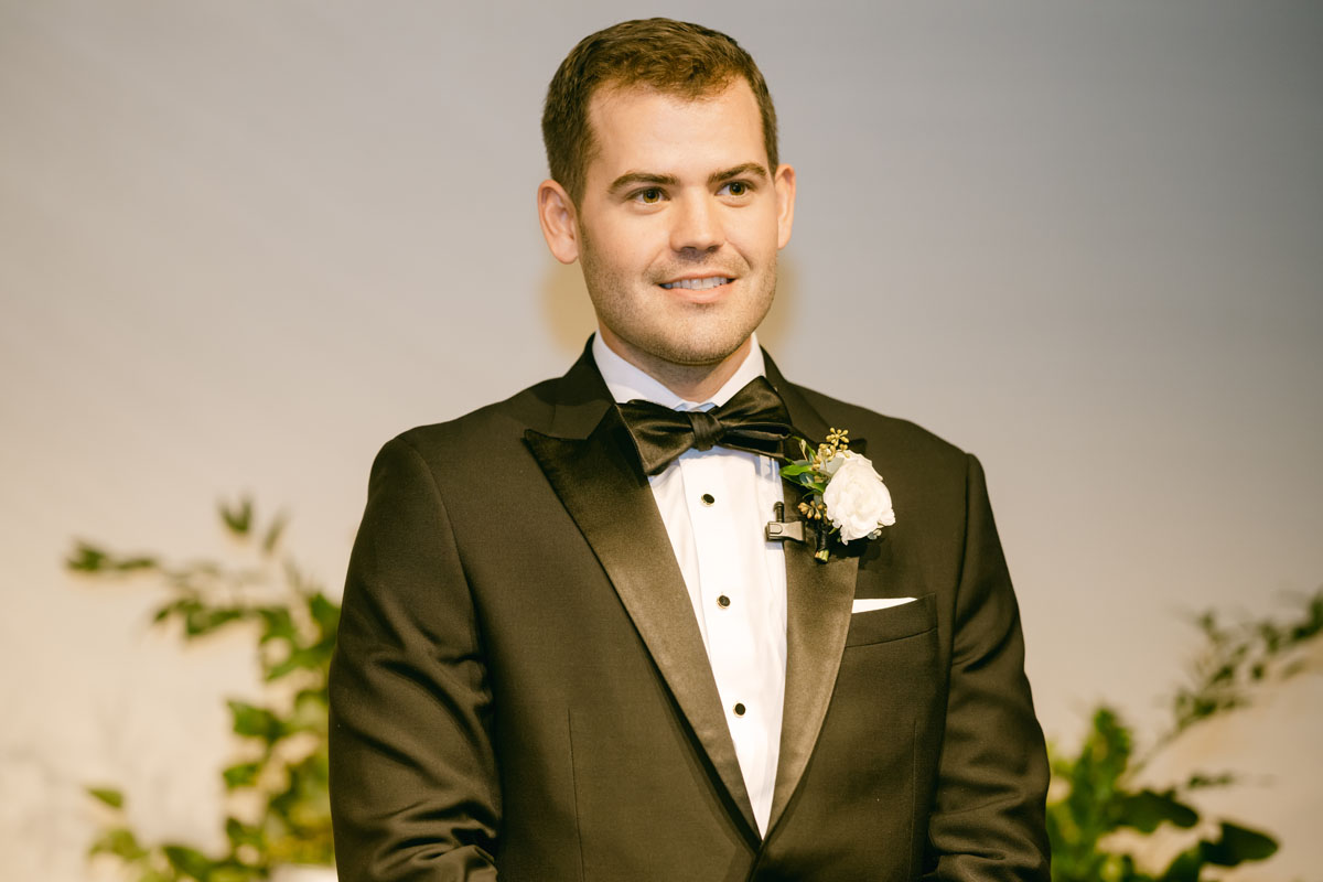 groom seeing bride walking down the aisle