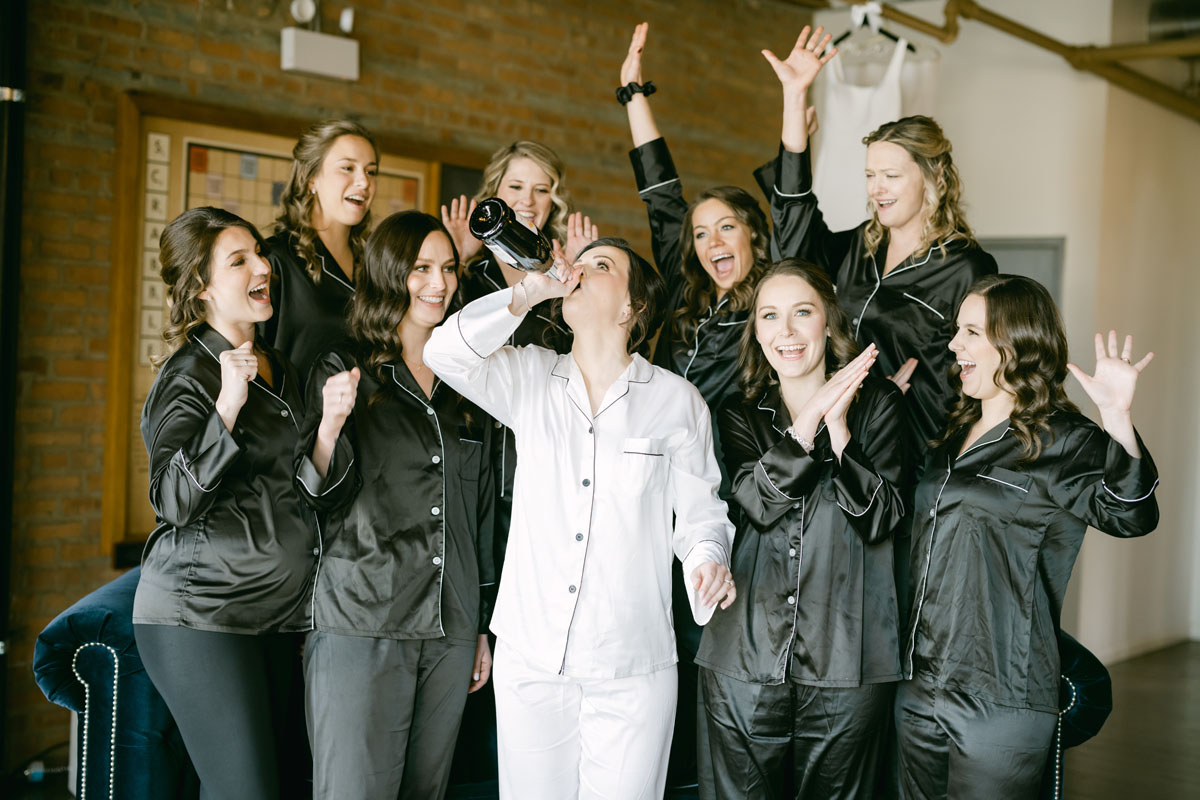 bridesmaids pajama shot with champagne