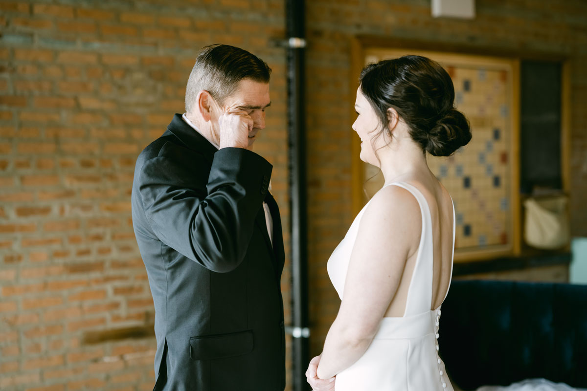 emotional dad with bride