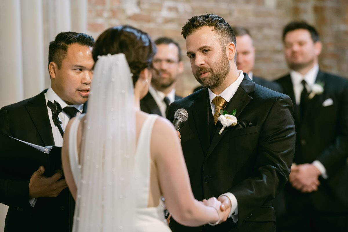 bride and groom exchanging vows