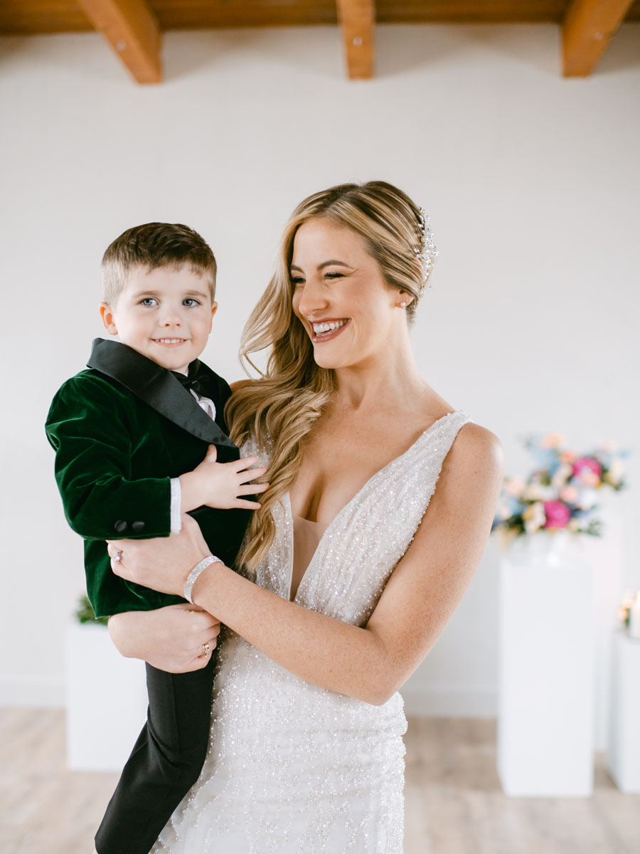 bride holding cute ring bearer