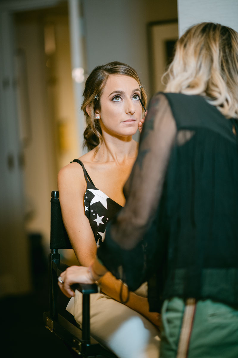 bride getting makeup done