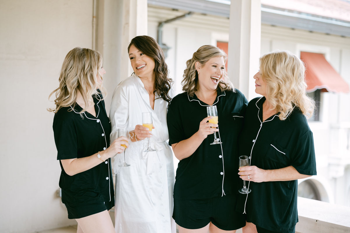 bride with her sisters on balcony at armour house