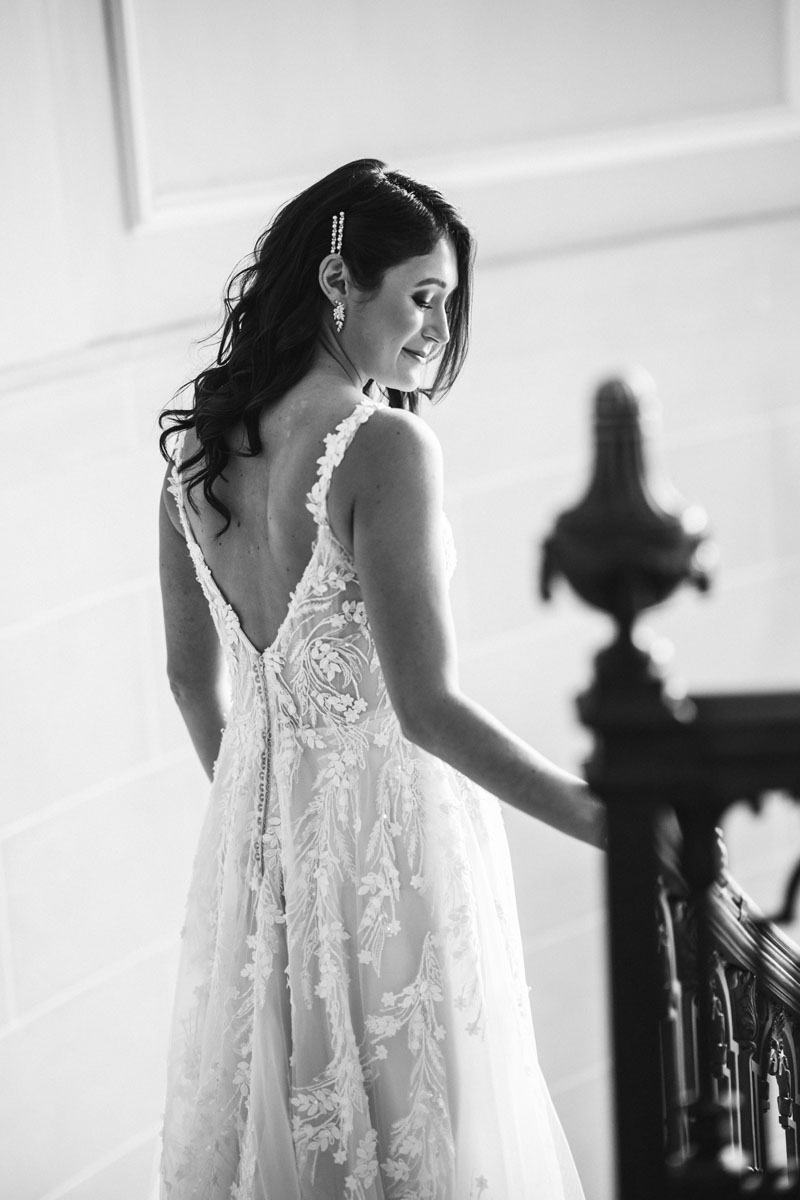 armour house wedding black and white photography bride walking down stairs