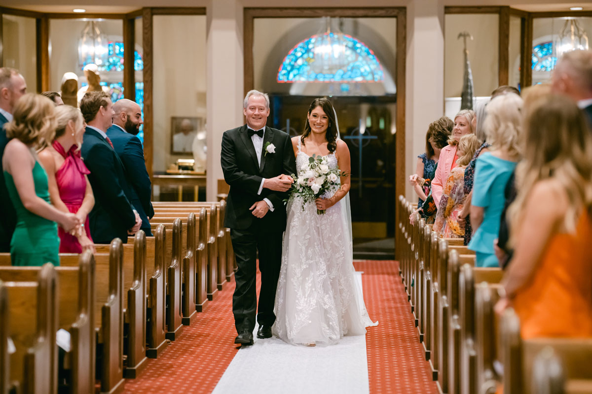 church of st mary wedding bride walking down the aisle with her dad