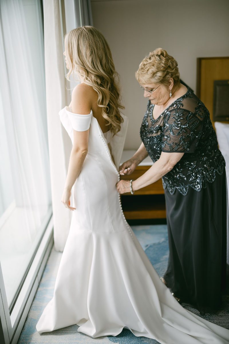 bride with her mom getting ready