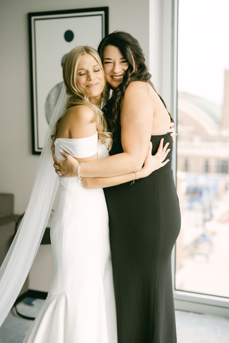 bride hugging maid of honor
