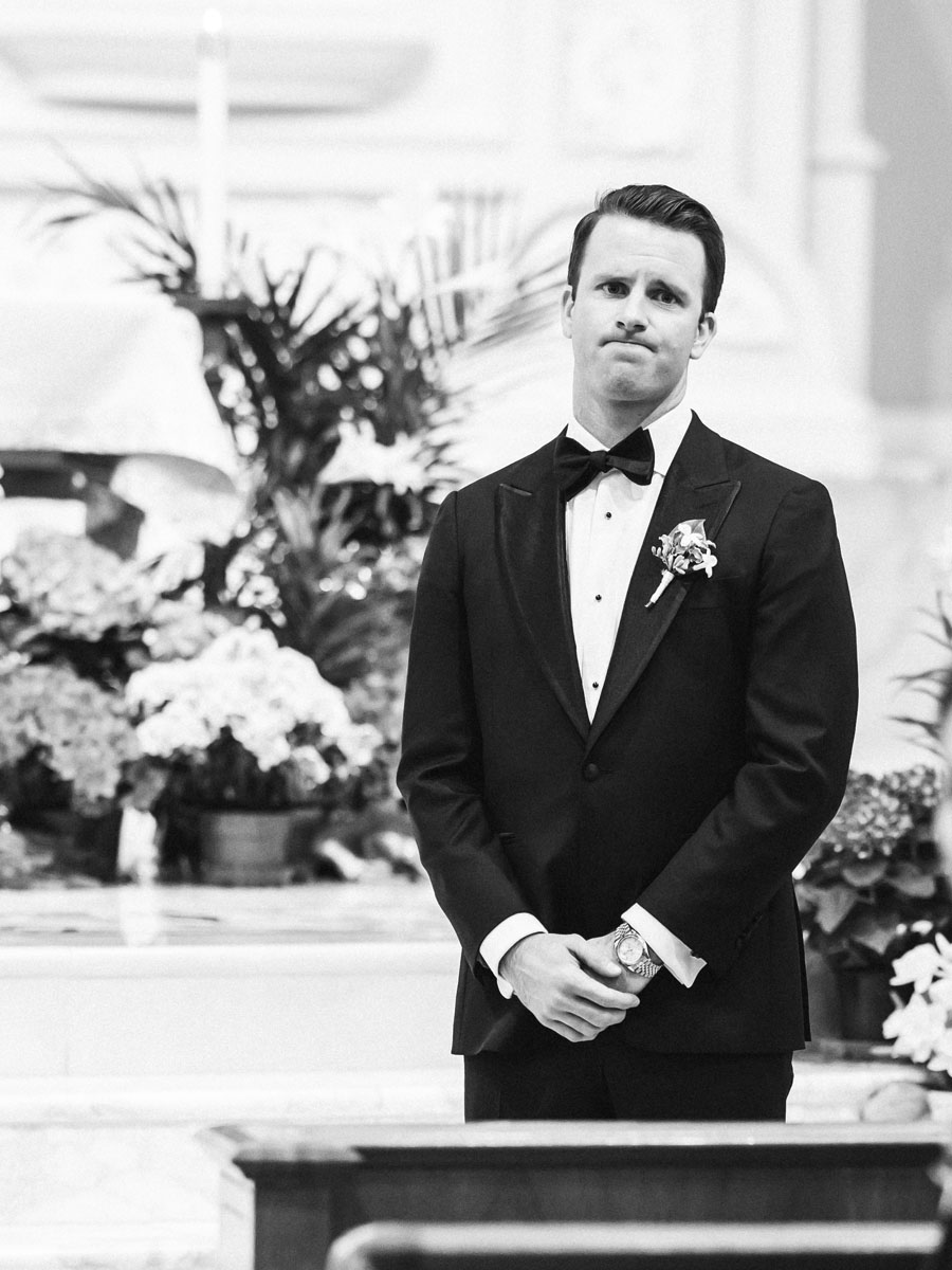 old st pat's wedding ceremony groom watching bride walk down the aisle