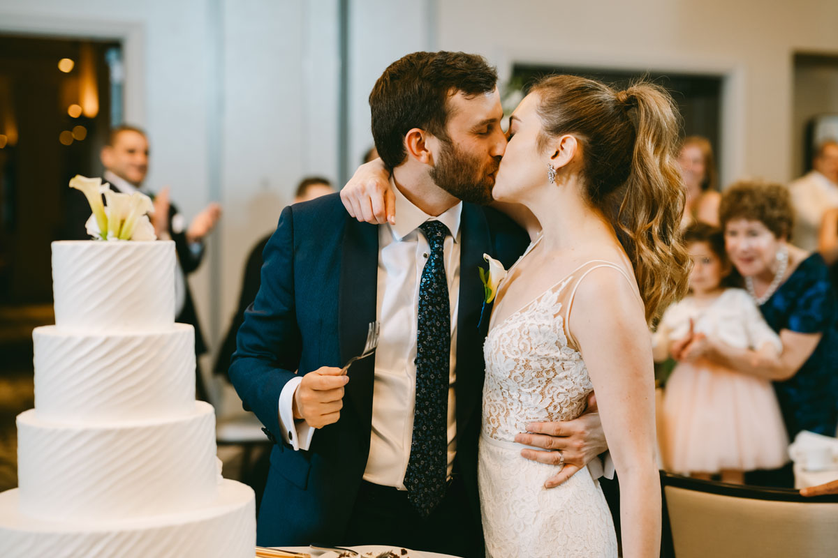 bride and groom cutting the cake