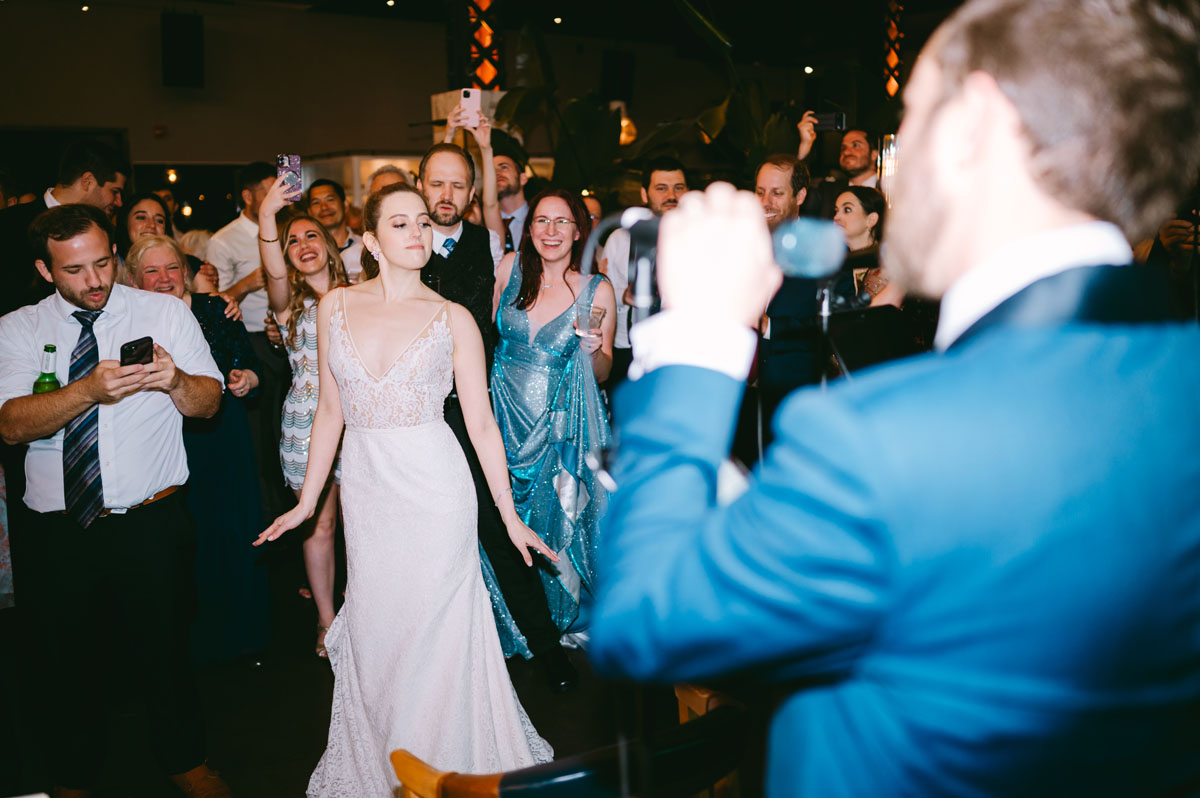 groom singing to bride