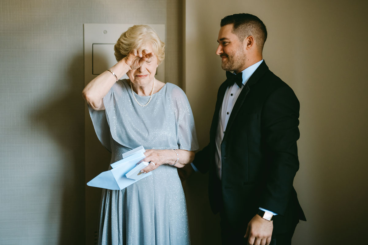 grandmother crying with the groom