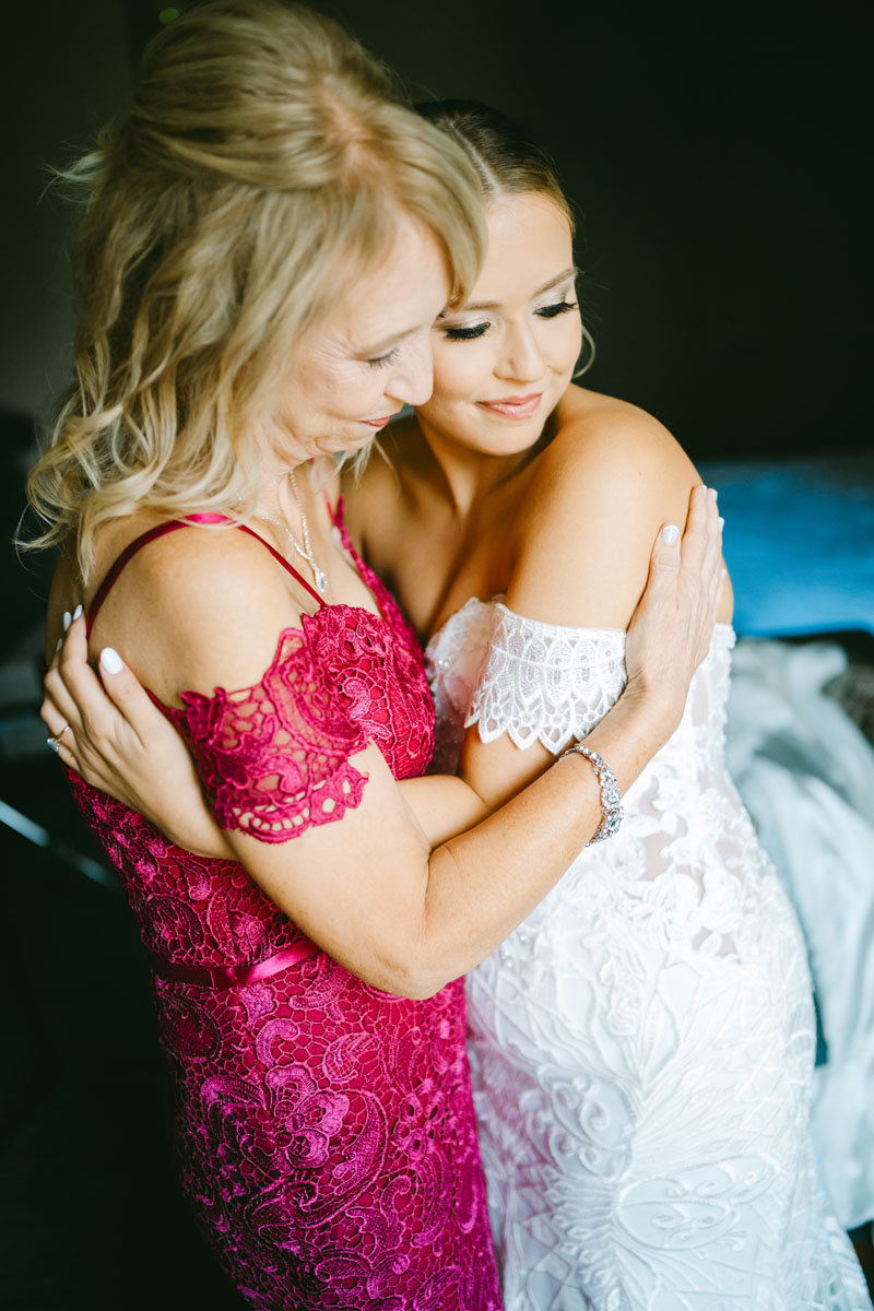 bride with mom on wedding day