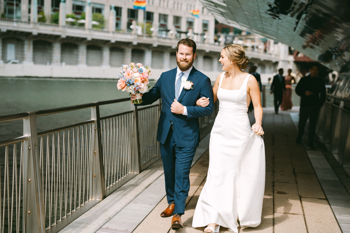 bride and groom laughing on the chicago riverwalk wedding